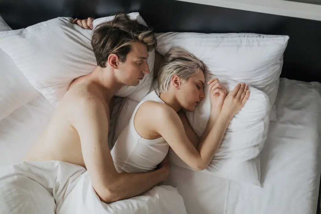 Couple Sleeping Together in Bed