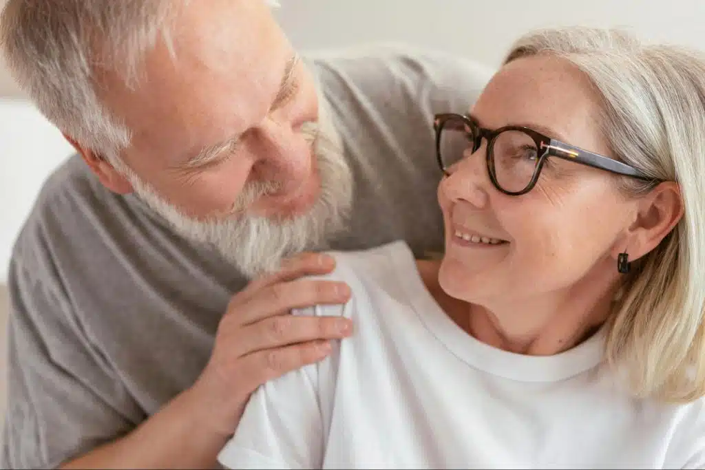 A man and woman looking at each other 
