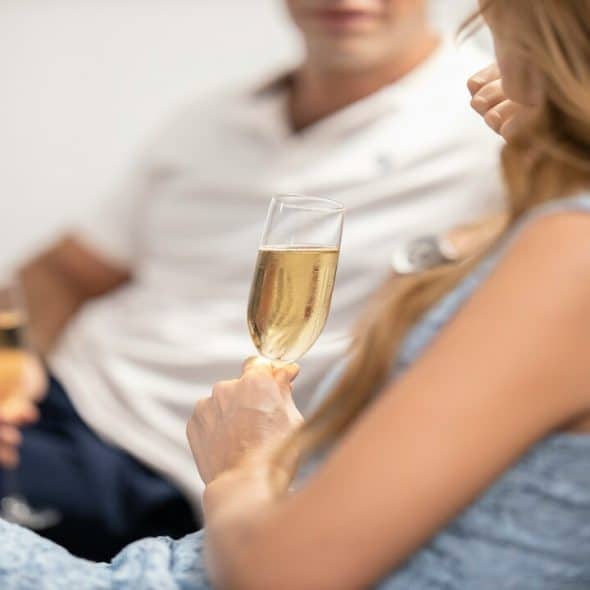 A couple having champagne together