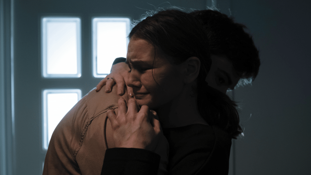 A man comforting his sad wife