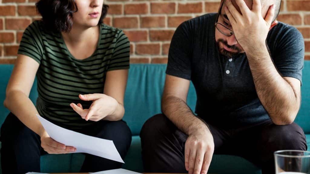 A couple managing the debt.