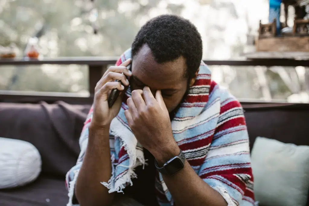 A Sad Man talking on the Phone