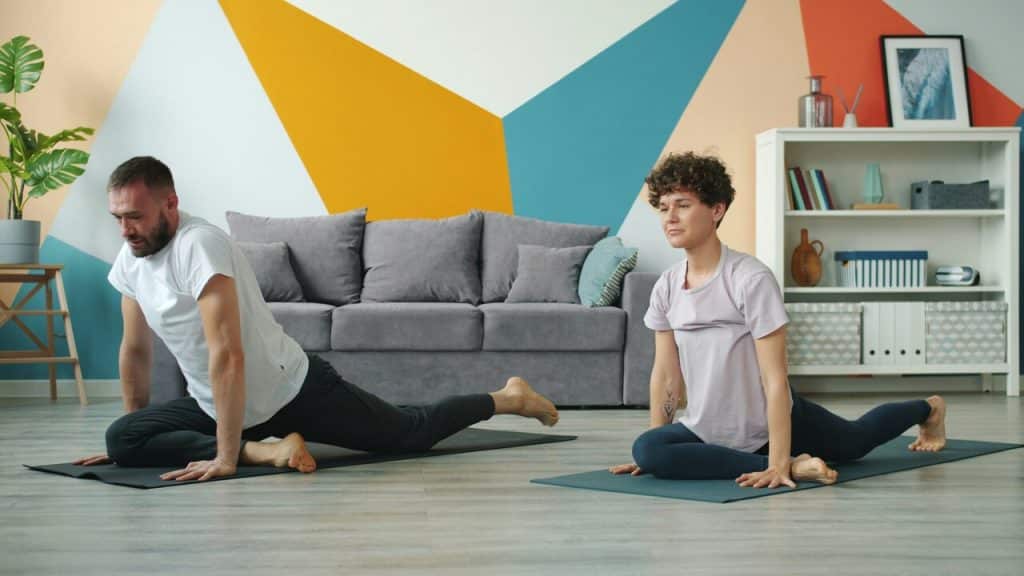 A couple doing yoga together 