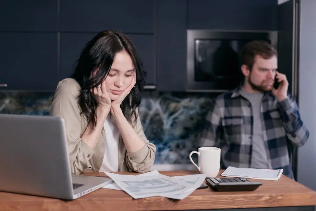 A Woman Looking at a Document Resting her Chin on her Hands