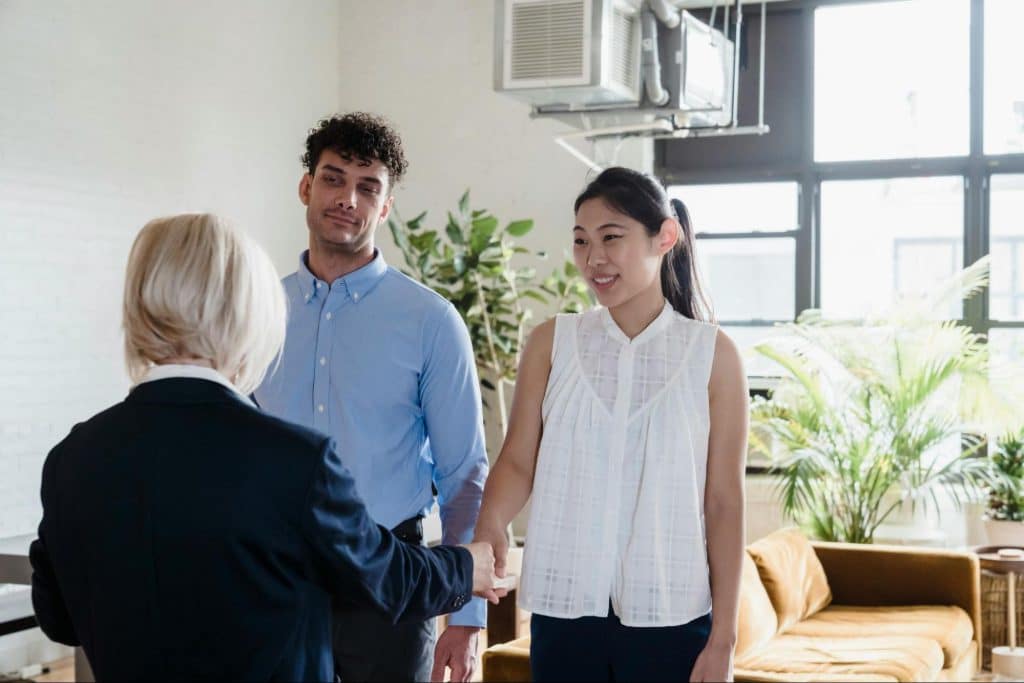 A man and woman talking to someone