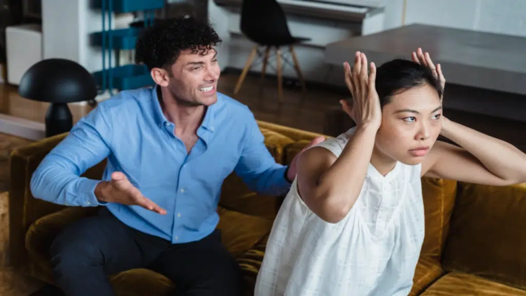 A couple fighting in the living room