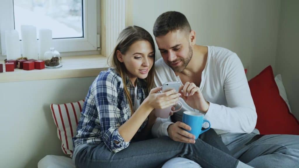 Couple having a heartfelt conversation on the couch