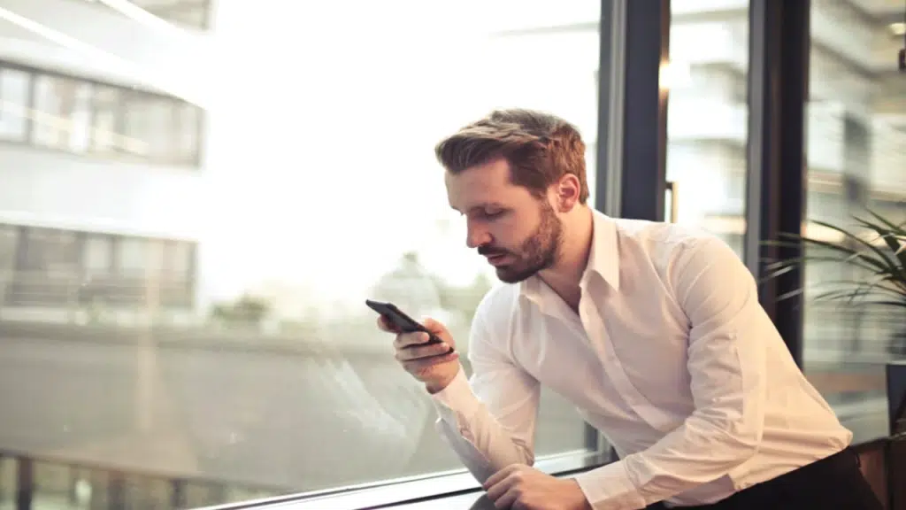 A man texting in the office