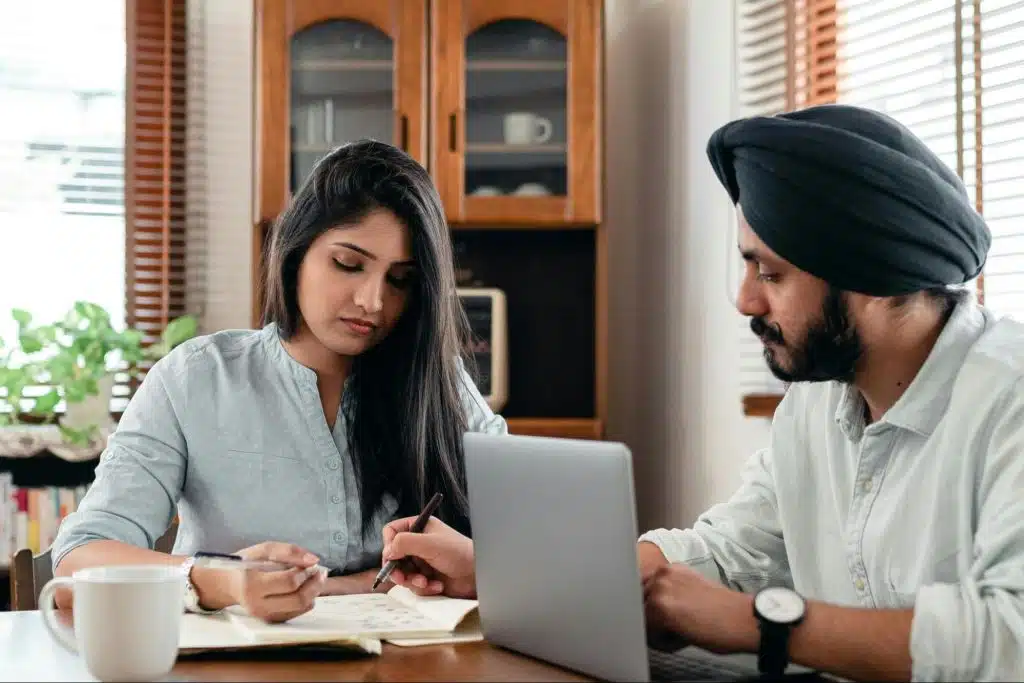 A man teaching a woman