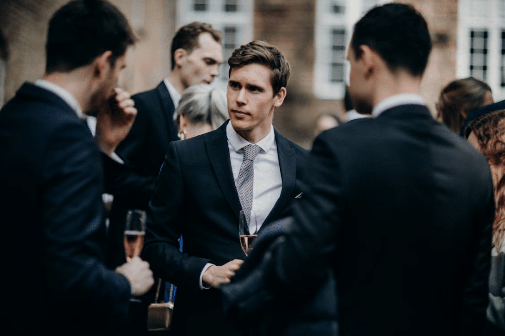 Men in Suits Standing and Talking
