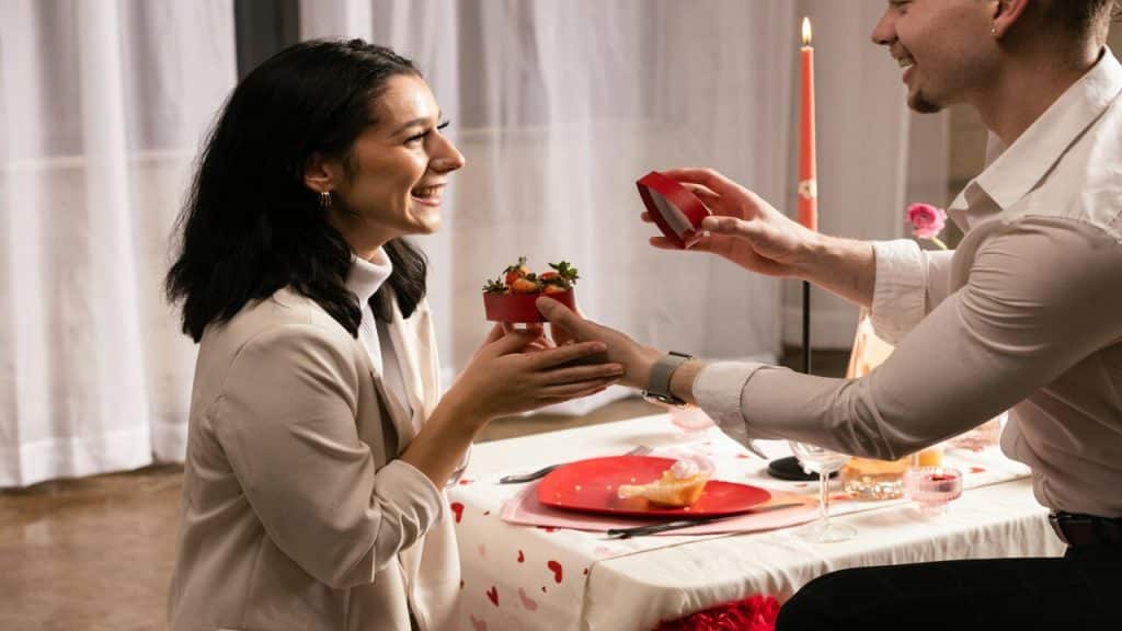 A man giving his wife a gift