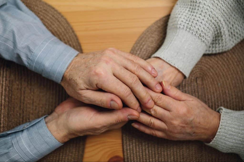 A man and woman holding hands