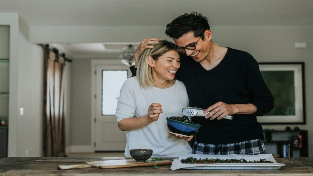A couple preparing a meal together