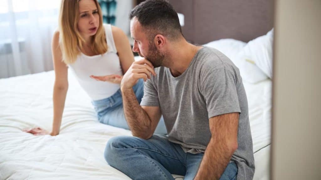 Man refusing to talk while wife looks upset