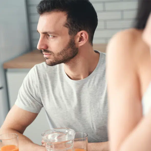 A man looking thoughtful during breakfast