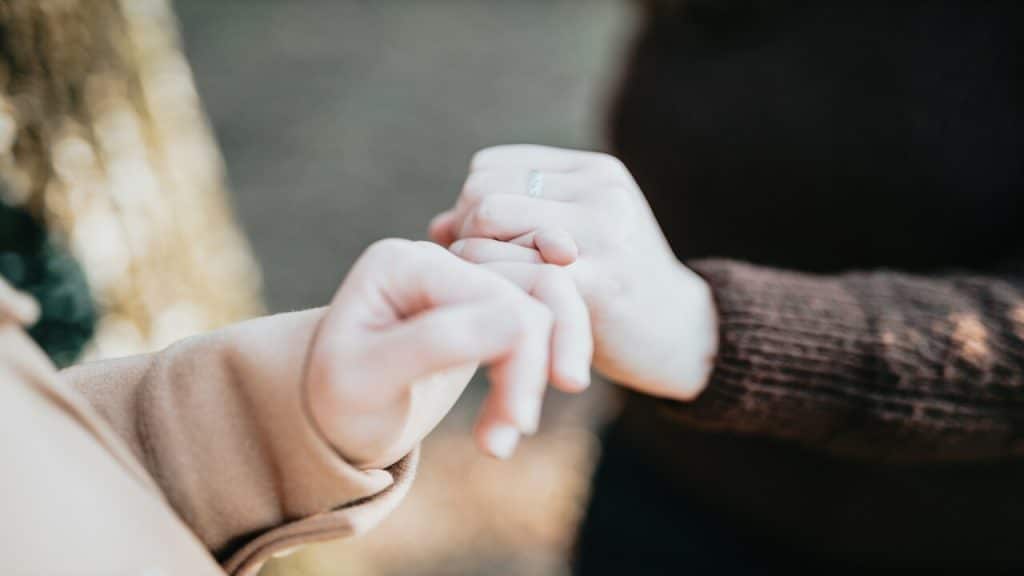 A couple doing the pinky swear