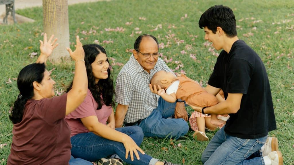 A family enjoys time with a baby.
