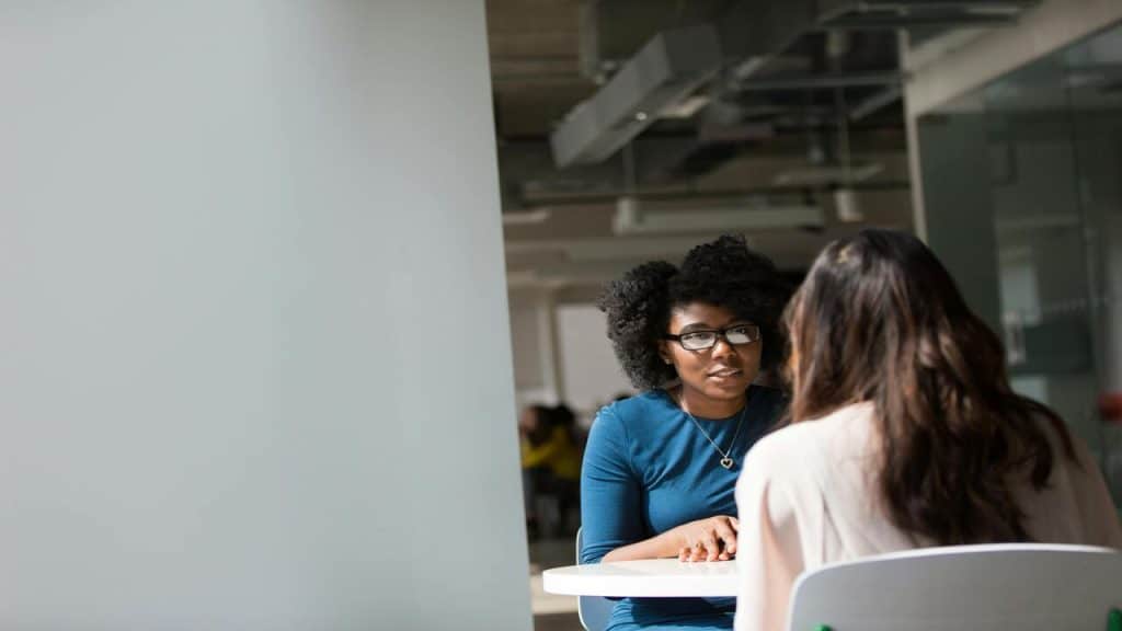Colleagues talking at work