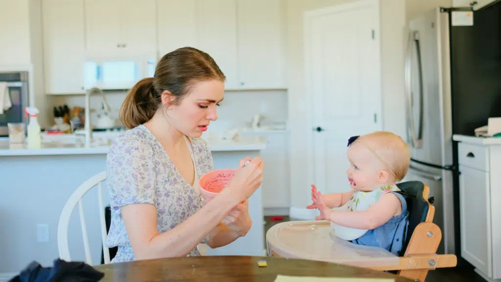 A mom feeding her baby