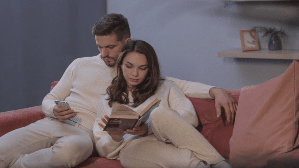 A couple doing their own thing at home
