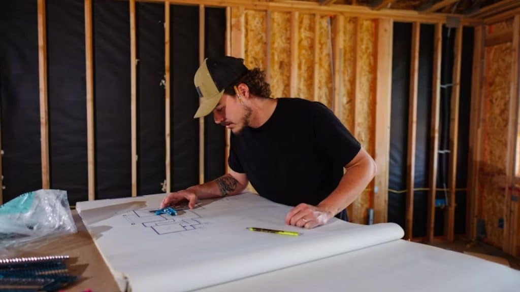 Man working on a creative project in a focused workspace