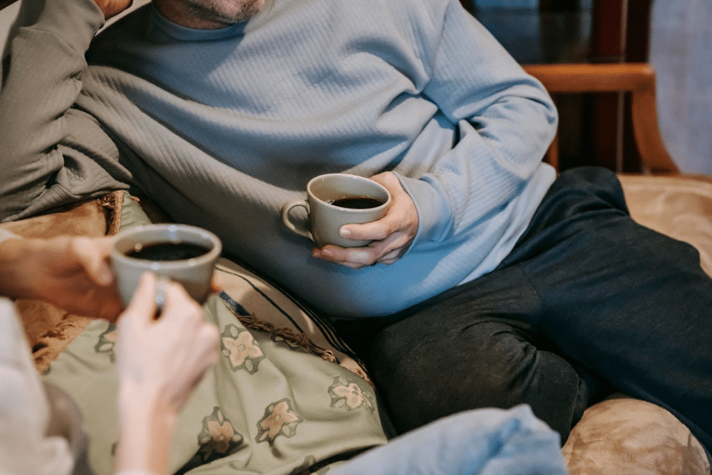 Couple drinking strong coffee in cups