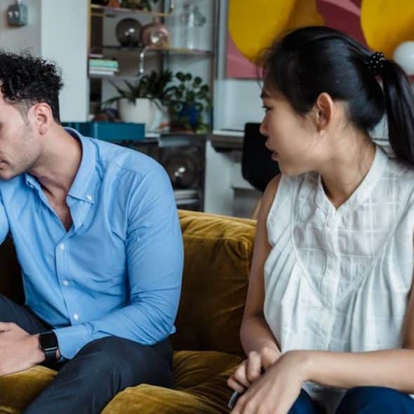 A man appearing to be physically and emotionally detached with his partner