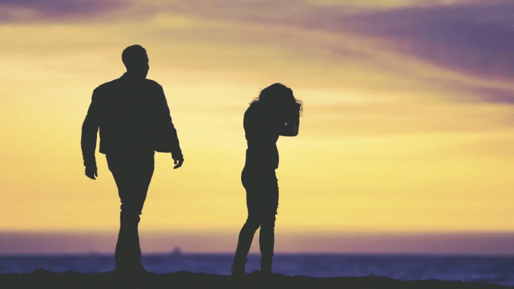 A couple fighting at dusk