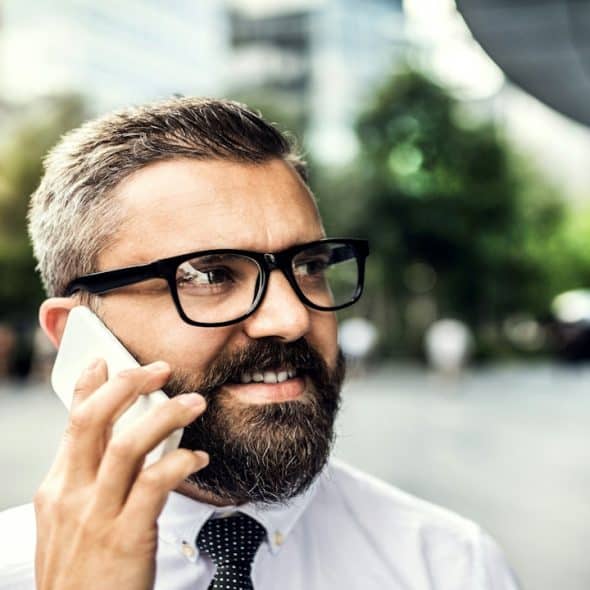 Man making a call in the city.