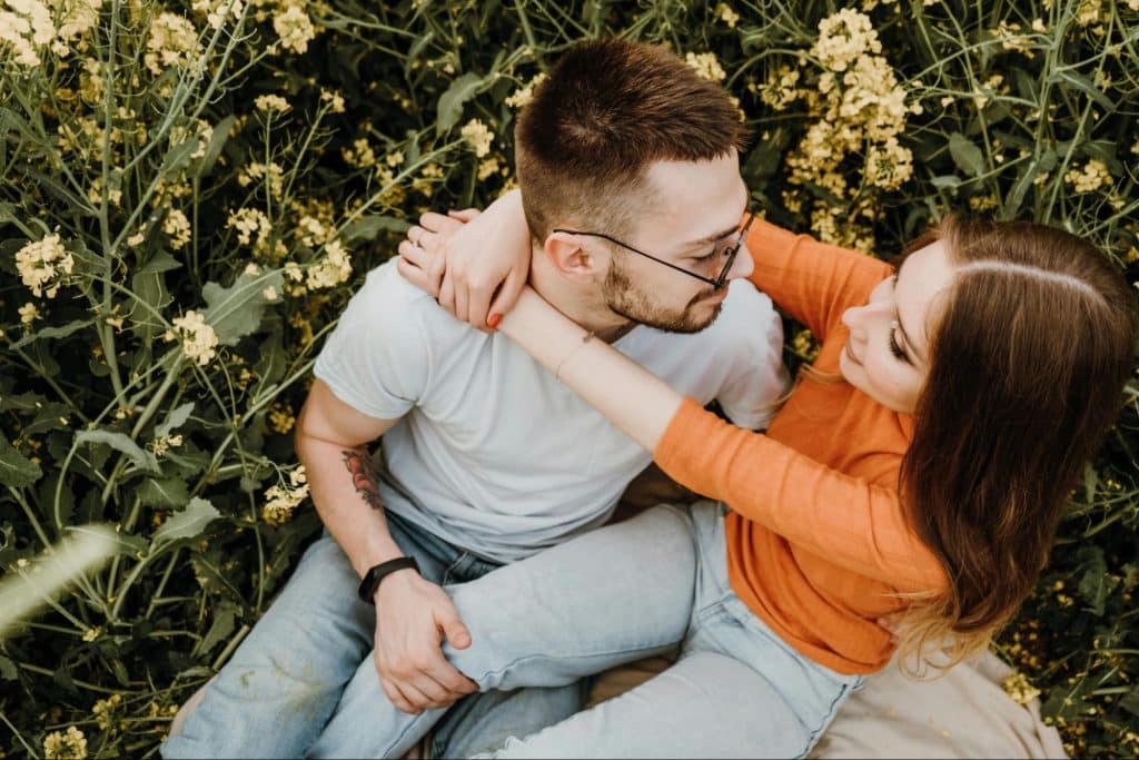 A woman hugging a man