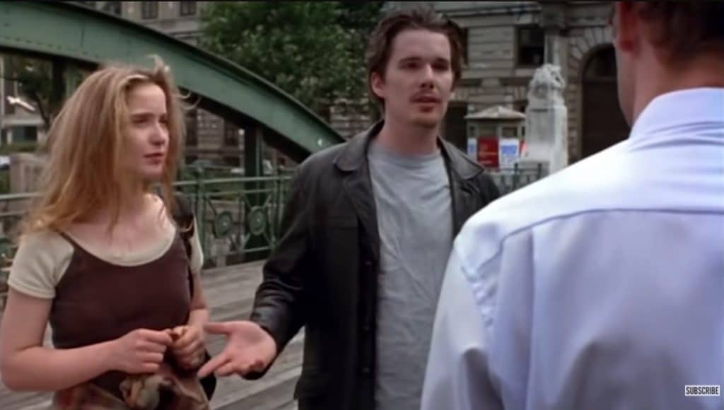 A man and woman talking to a man