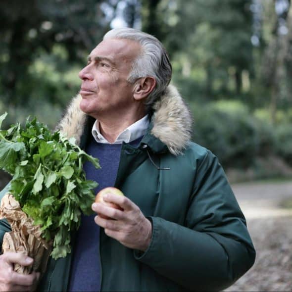 A man holding a green leaves