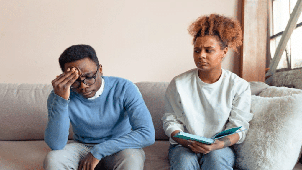 A couple frowning in therapy