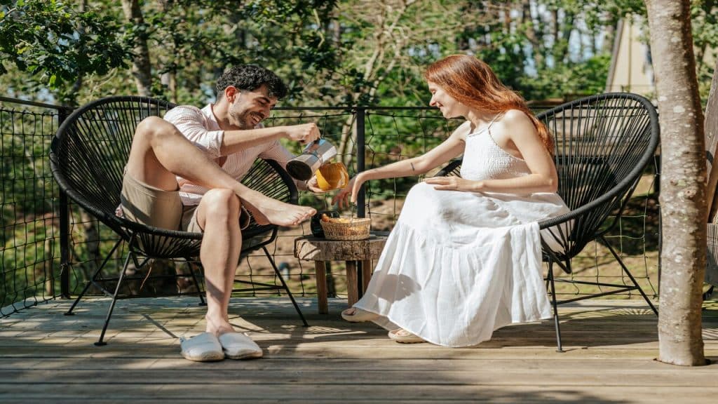 A couple having breakfast on the balcony