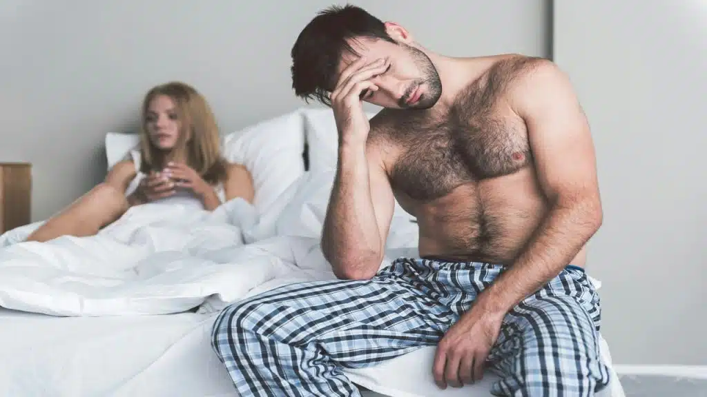 A man looking upset at his girlfriend 