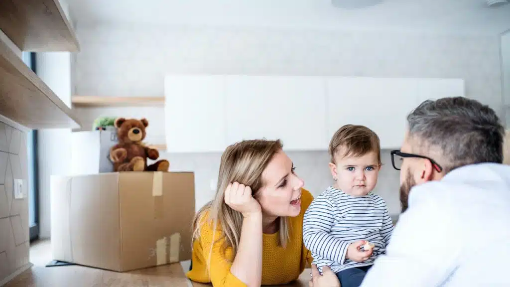 A happy couple with a toddler moved to a new house.
