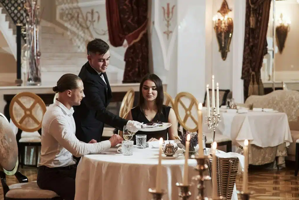 The couple is having dinner in a luxury restaurant.