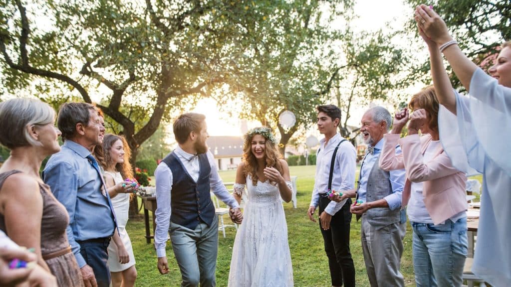 Bride, groom, and their guests at the wedding reception.