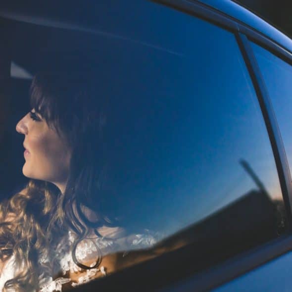 A man and a woman in a car.
