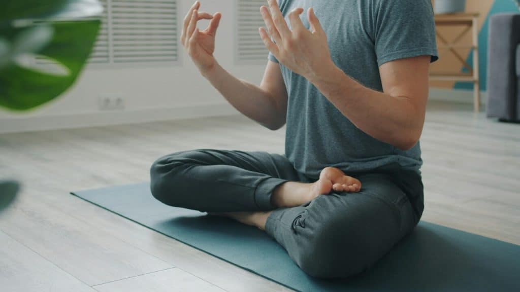 A man meditating during yoga