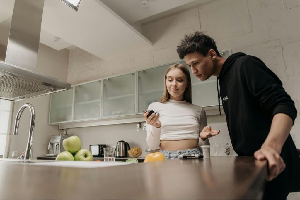 A man and woman in the kitchen