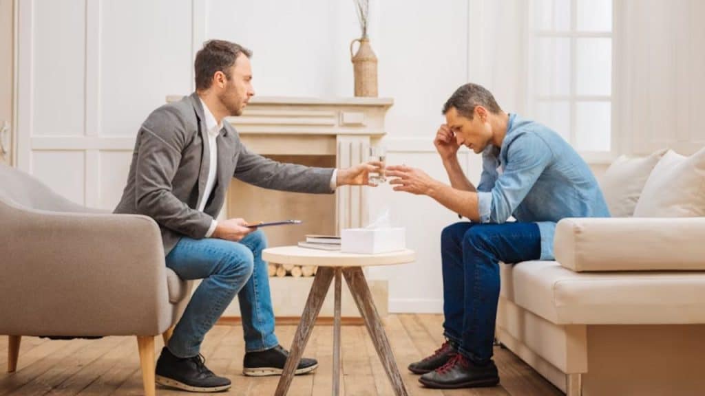 Man helping another man