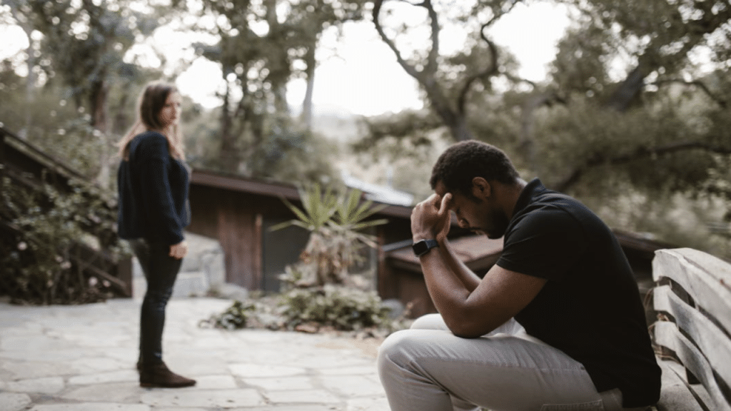 A woman looking at her stressed husband