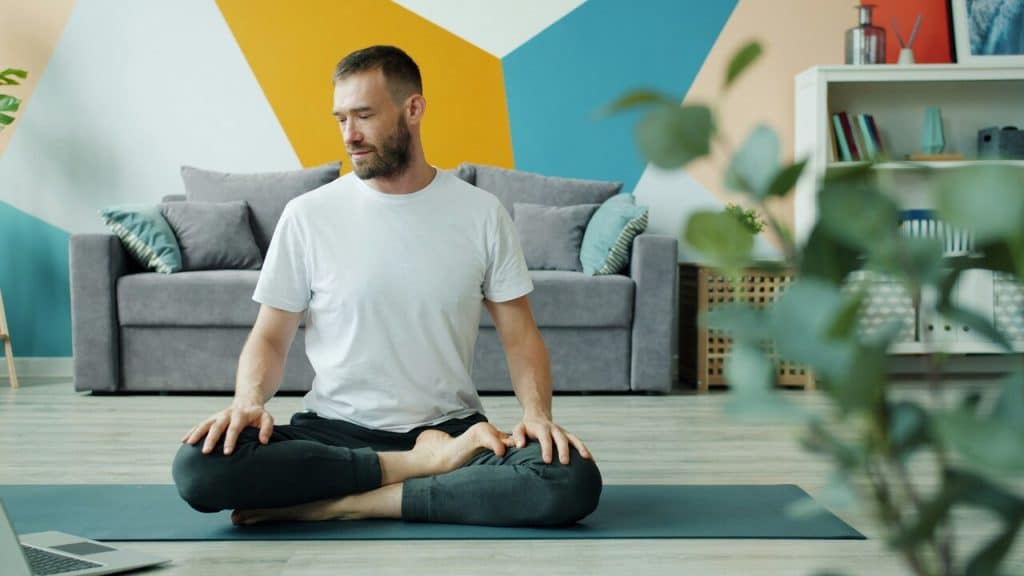 A man practicing yoga