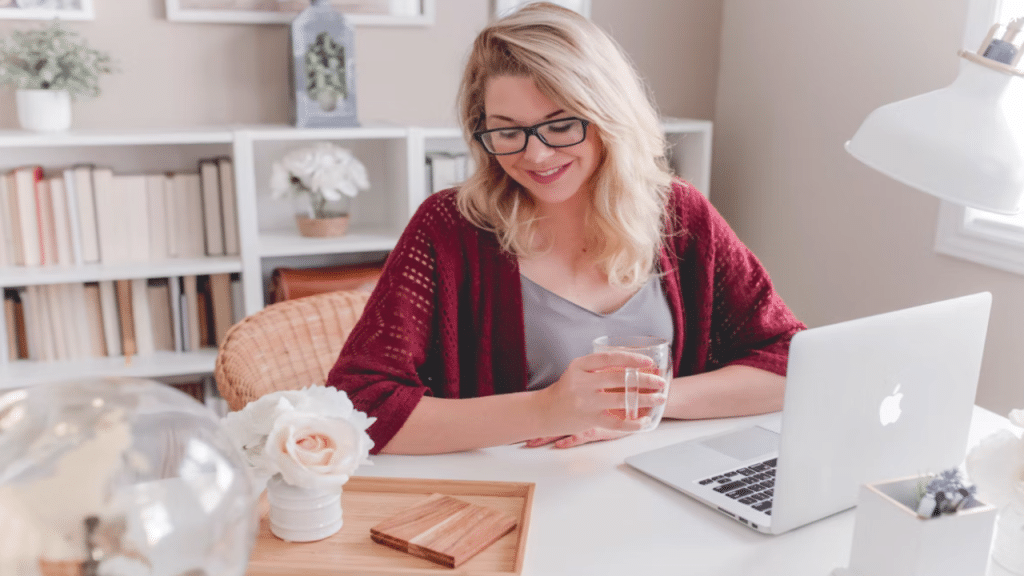 A woman having tea at work