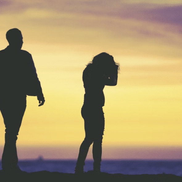 A couple fighting at dusk