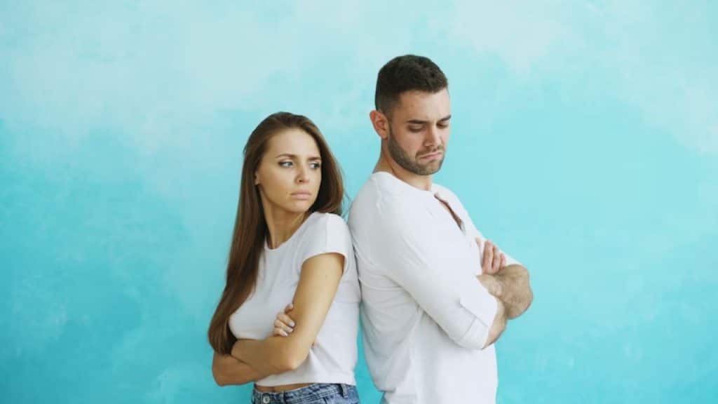 Man emotionally disengaged while his partner opens up