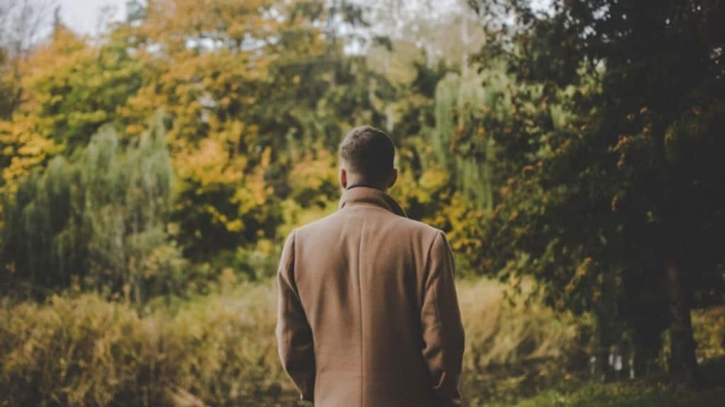 Man walking the same route every day, appearing lost in thought
