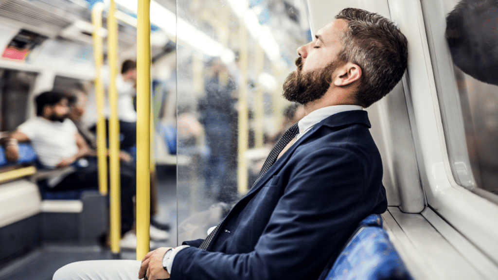 A man sleeping in the subway