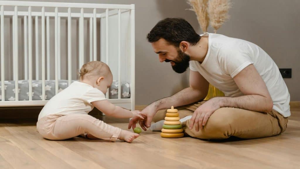 A dad playing with his baby